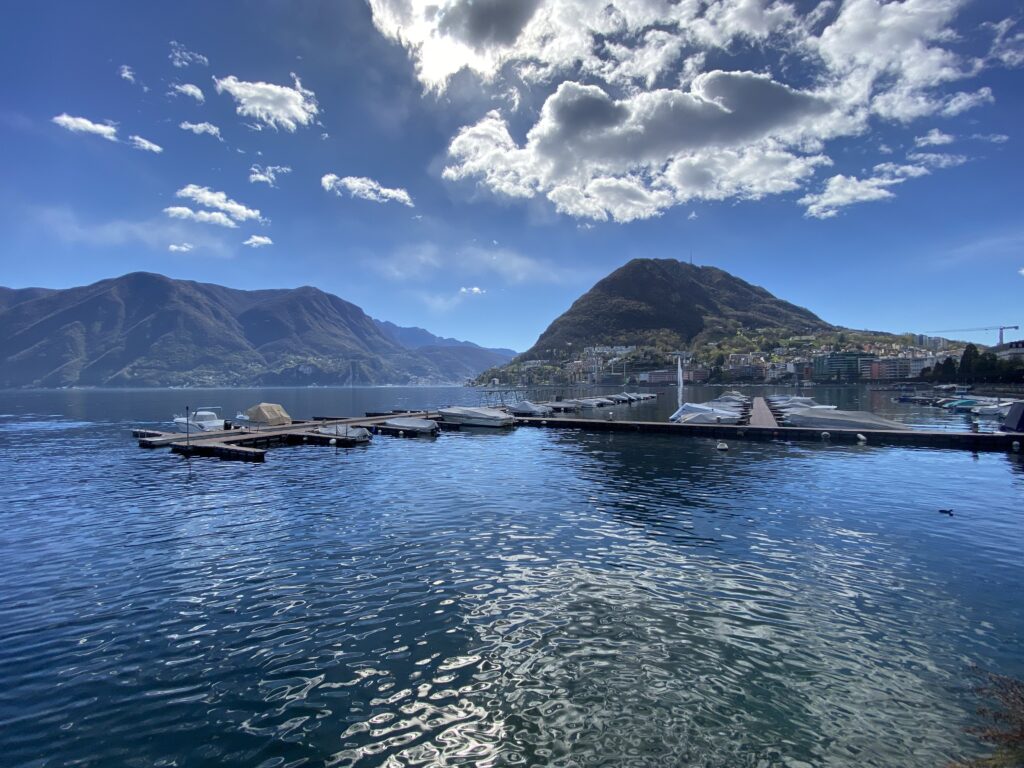 Stunning view of Monte San Salvatore, Lugano's iconic sugar loaf mountain, rising dramatically from the shores of Lake Lugano.