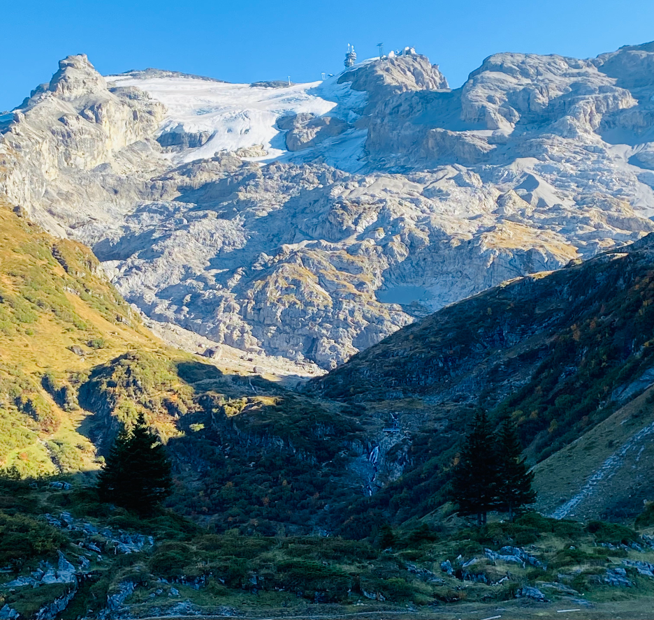 Mount Titlis rising majestically in the background, framed by a beautiful mountain landscape.