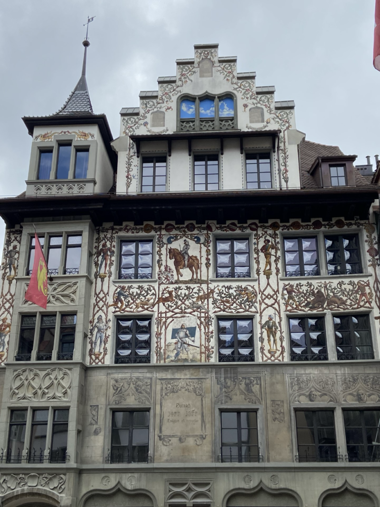 A traditional Swiss house in Lucerne's Old Town, featuring an ornate, colorful facade.