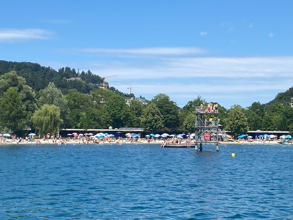 The Lido of Lucerne, featuring a sandy beach along the shoreline of Lake Lucerne. 