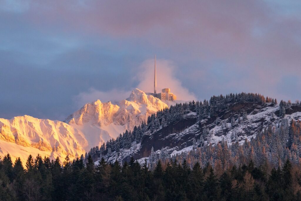 A scenic view of Säntis, one of the most beautiful mountains near Zurich, from Wildhaus Alt St. Johann, with the snow-capped peak rising majestically