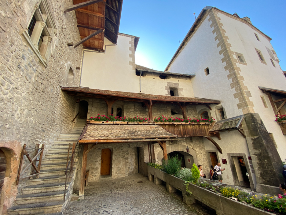 One of Chillon Castle’s courtyards, featuring historic stairs leading to upper levels of the fortress.
