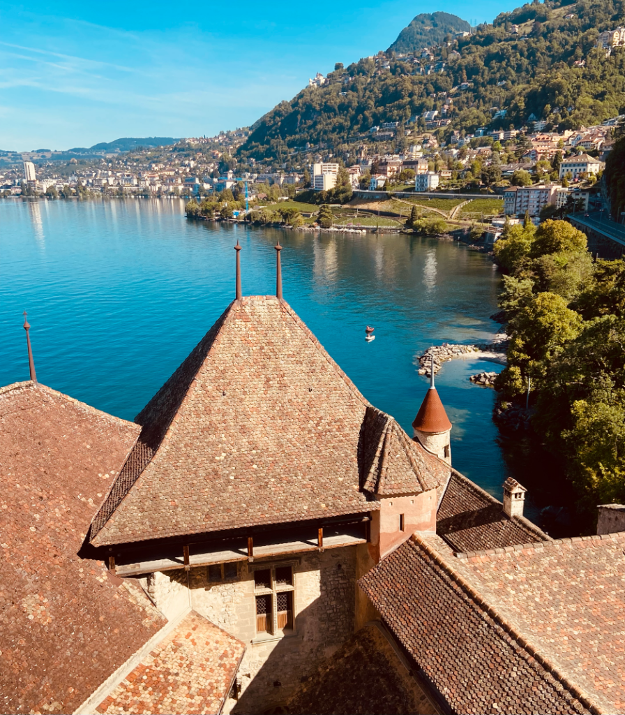 A view from Chillon Castle overlooking Montreux and the small swimming area next to the castle. 
