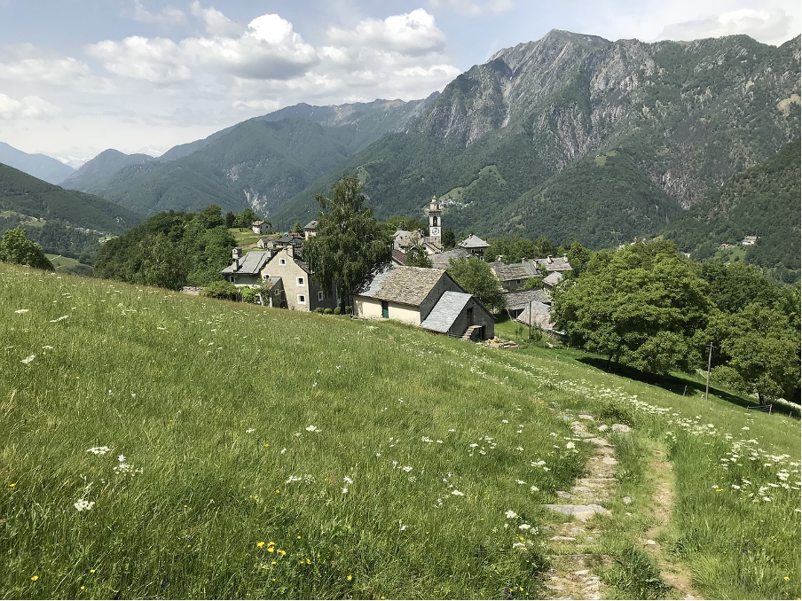 The picturesque and peaceful car-free mountain resort of Rasa in Ticino, nestled amidst rolling hills and verdant landscapes.