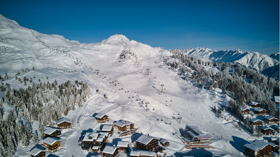 The snow-blanketed village of Bettmeralp in winter, a pristine car-free destination and a paradise for snow sports enthusiasts in the Swiss Alps.