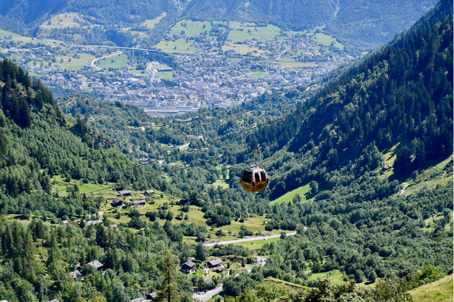 A gondola ascending towards the car-free mountain resort of Belalp in the Valais region of Switzerland, offering stunning alpine views.