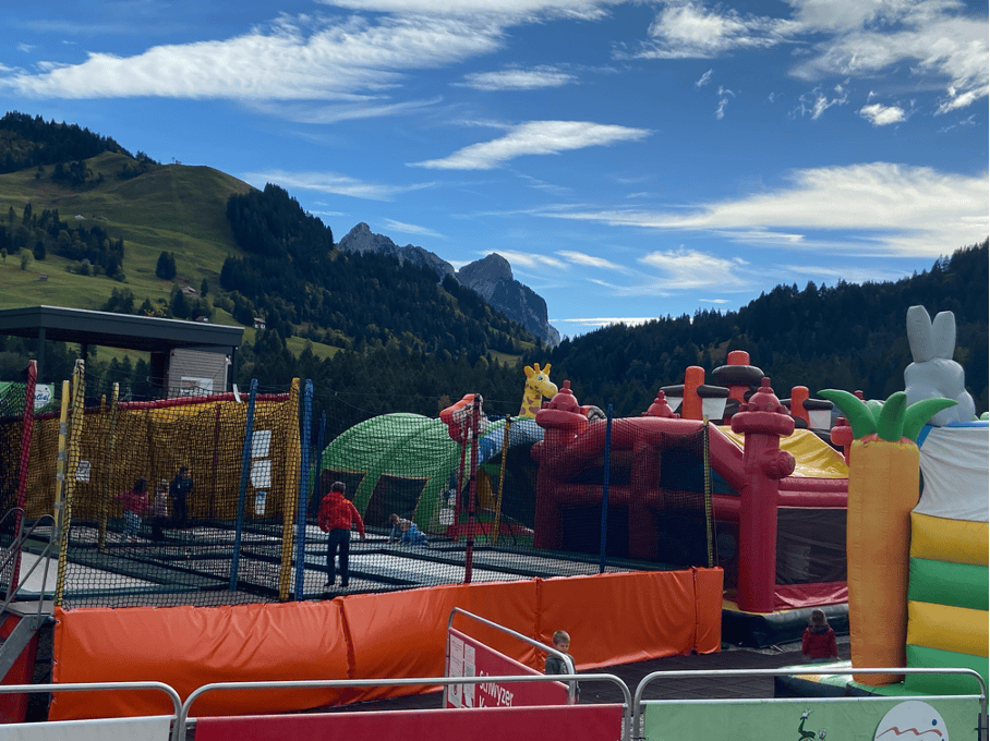 A vibrant bouncy castle playground on Mostelberg Sattel-Hochstuckli, a fun and family-friendly activity that makes it a top destination for exploring Switzerland with kids.