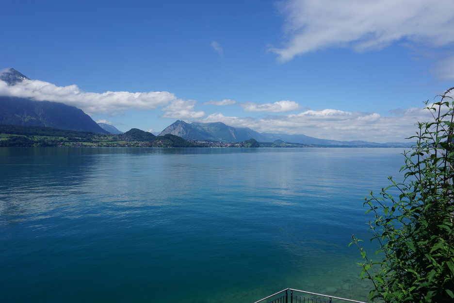 Lake Thun with crystal clear, emerald blue waters.