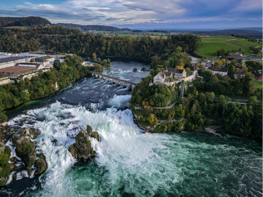 Bird’s-eye view of the Rhine Falls with Laufen Castle, featuring its glass lift and adventure trail along the Southern Bank.