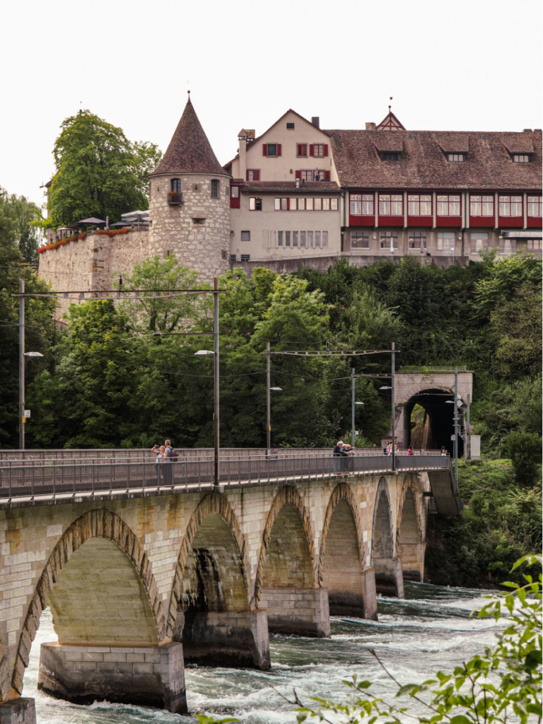 Bridge connecting the Northern and Southern Bank of the Rhine Falls, a scenic crossing offering panoramic views of the waterfall.