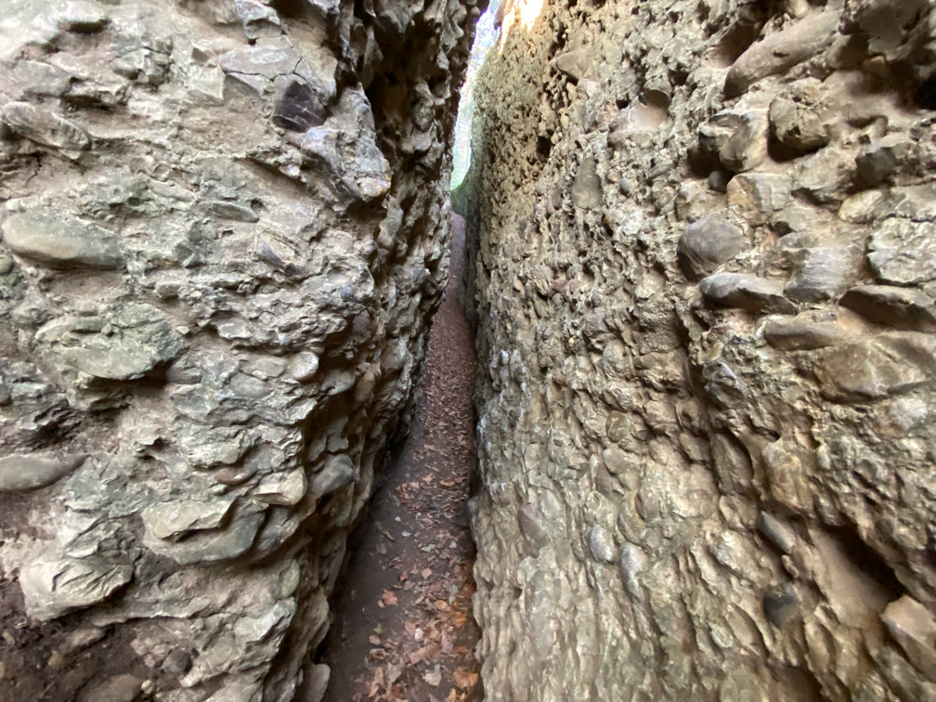 Inside the rugged Bachtelspalt crevice, where the passage gradually narrows, creating an exciting challenge for hikers exploring this hidden gem.