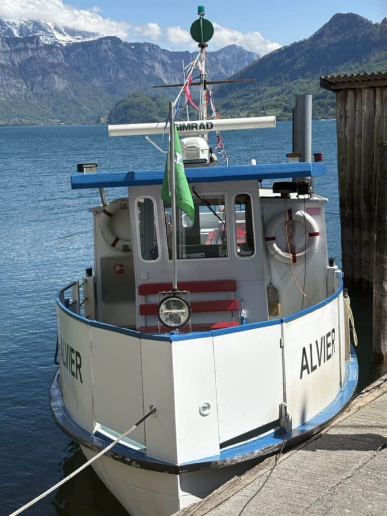 Passenger boat waiting at dock in car-free village of Quinten