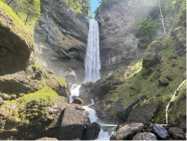 The breathtaking 46-meter-tall Berschis Waterfalls in Eastern Switzerland, cascading down rugged rock formations.