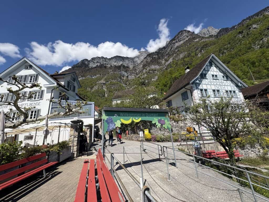 Boat dock in Quinten village with traditional lakeside houses
