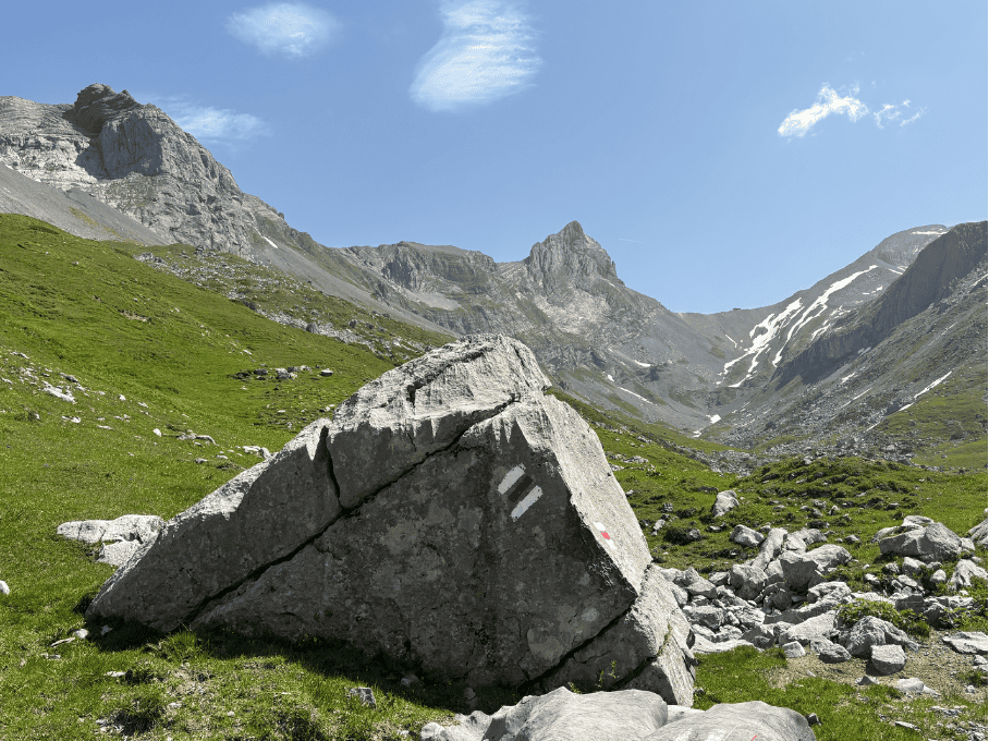 Rocky alpine terrain at Glattalp with rugged mountain peak in the background