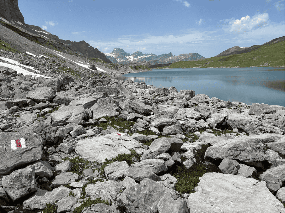 Rocky shore of Glattalpsee, a hidden alpine lake in Central Switzerland