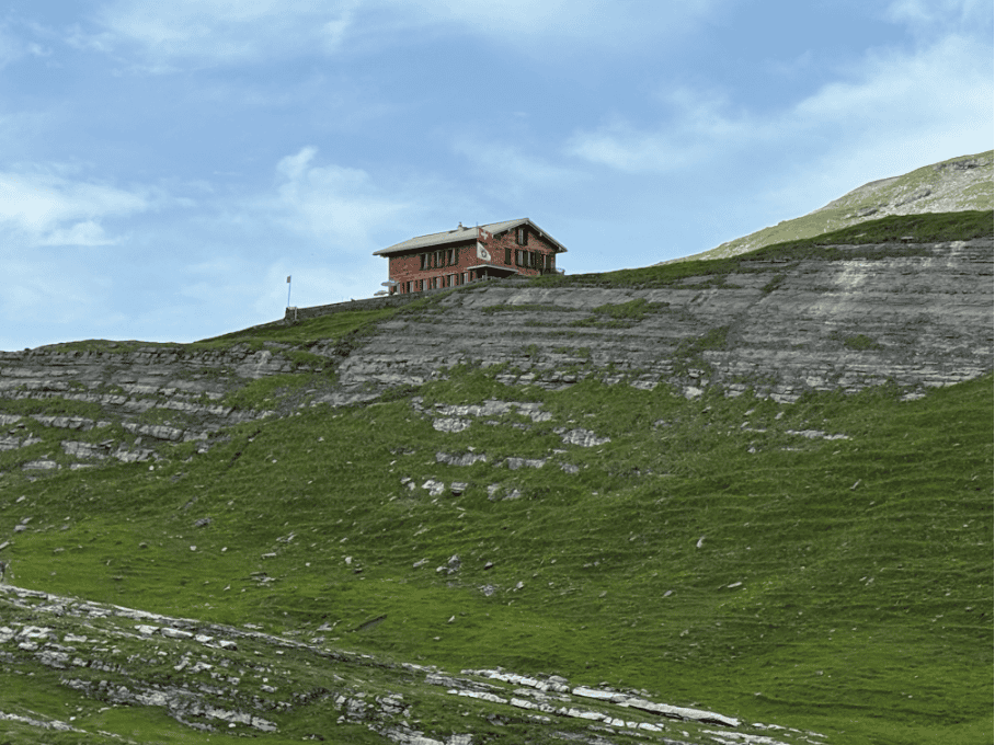 SAC Glattalphütte mountain hut overlooking Glattalp, where hikers can stay overnight