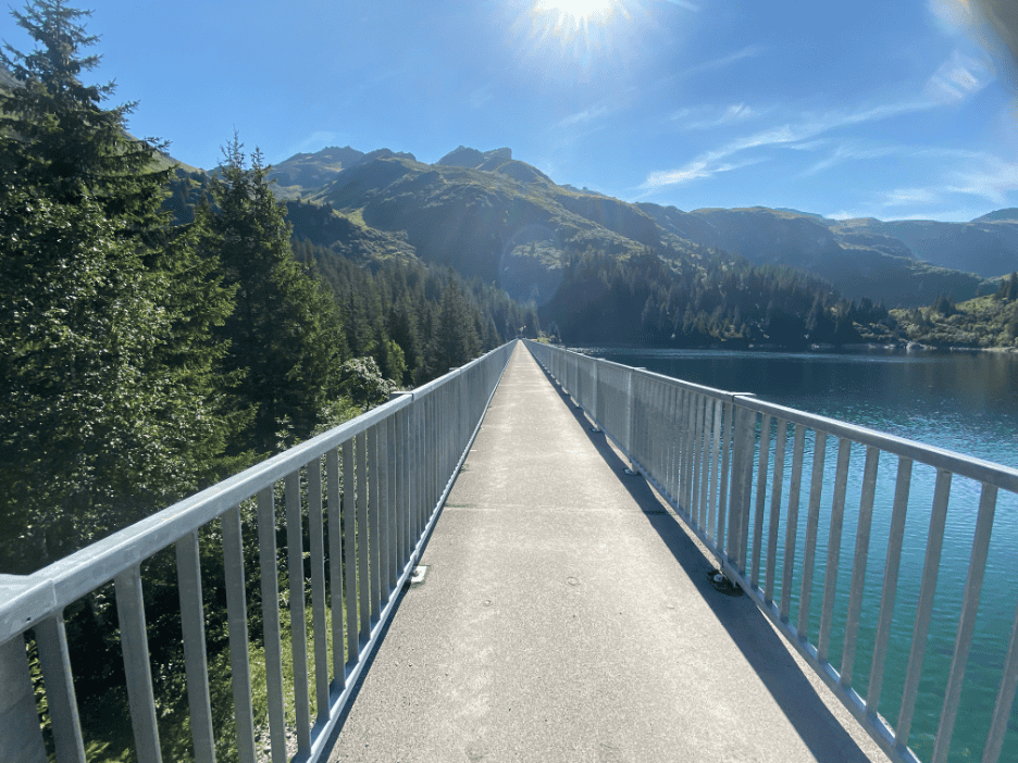 Dam at Garichti Lake on Mettmenalp, a hidden alpine gem in Switzerland off the beaten path