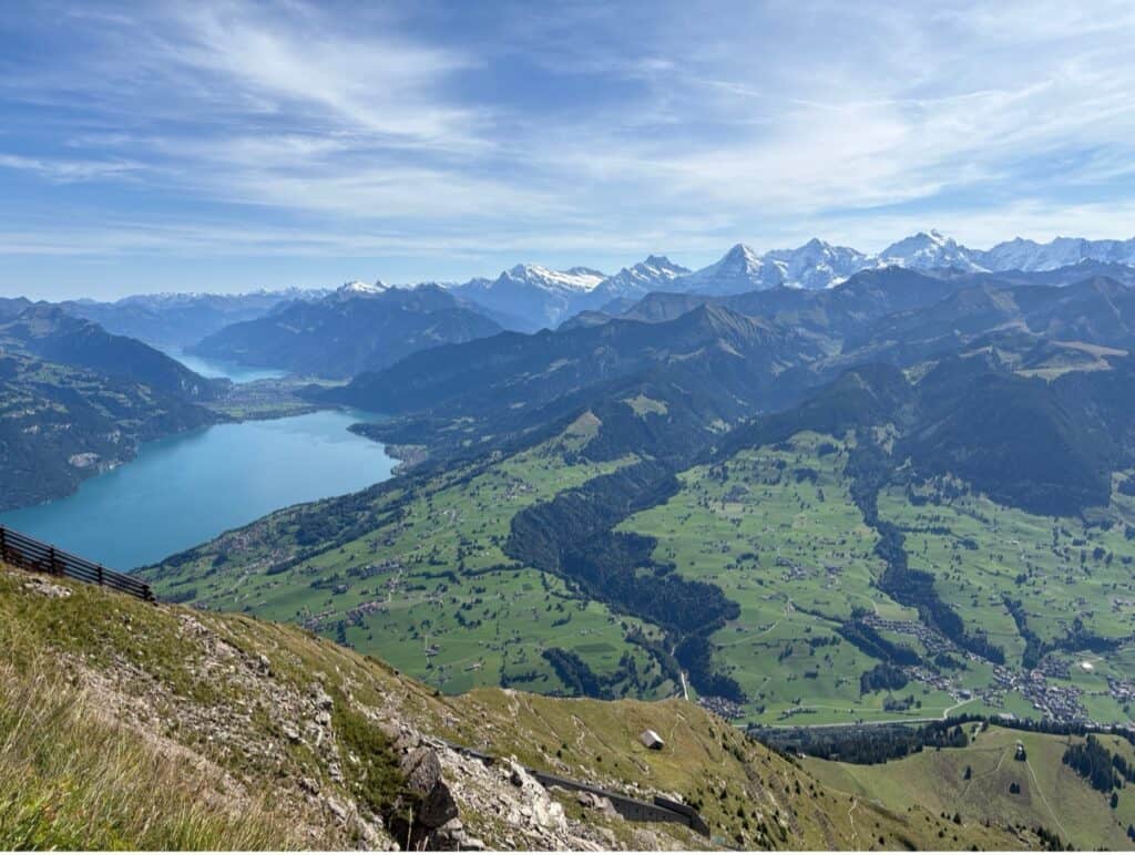 View from Mount Niesen summit over Lake Thun and Lake Brienz with the Eiger, Mönch, and Jungfrau in the distance