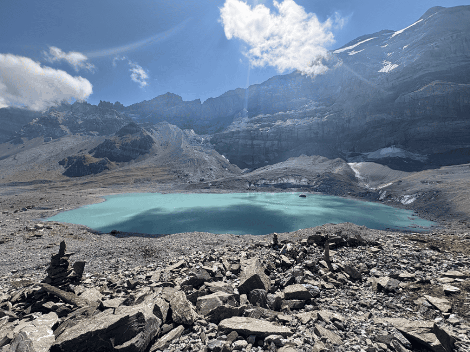 Turquoise Gletscherseeli glacier lake, surrounded by rocks, one of the most beautiful mountain lakes in Switzerland.