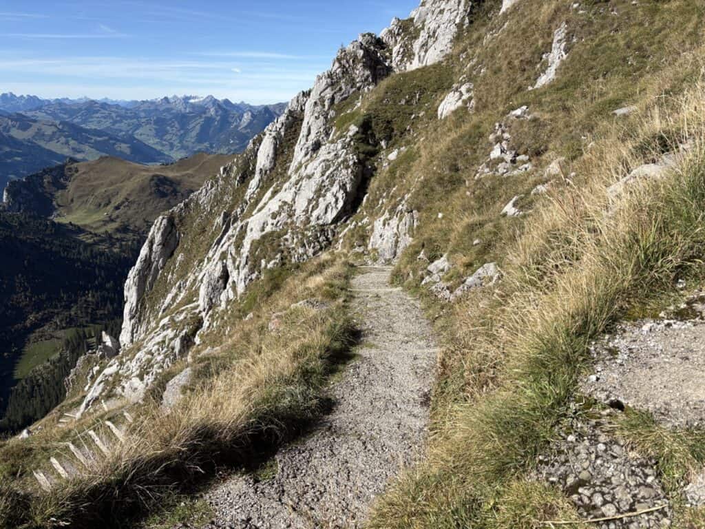 Mountain hiking trail descending from the Stockhorn summit. 