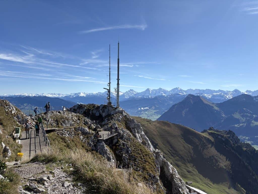 View from the Stockhorn summit with the Bernese Alps, including Eiger, Mönch, and Jungfrau, in the distance.
