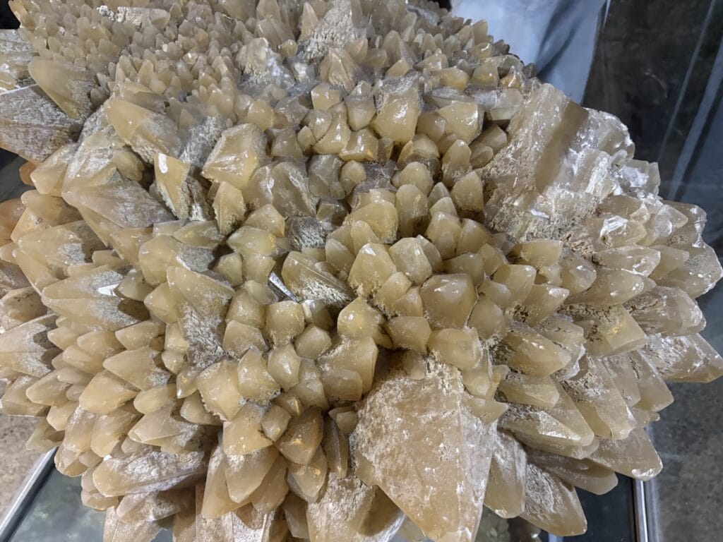 Close-up of a sparkling calcite crystal displayed inside the Stockhorn tunnel.