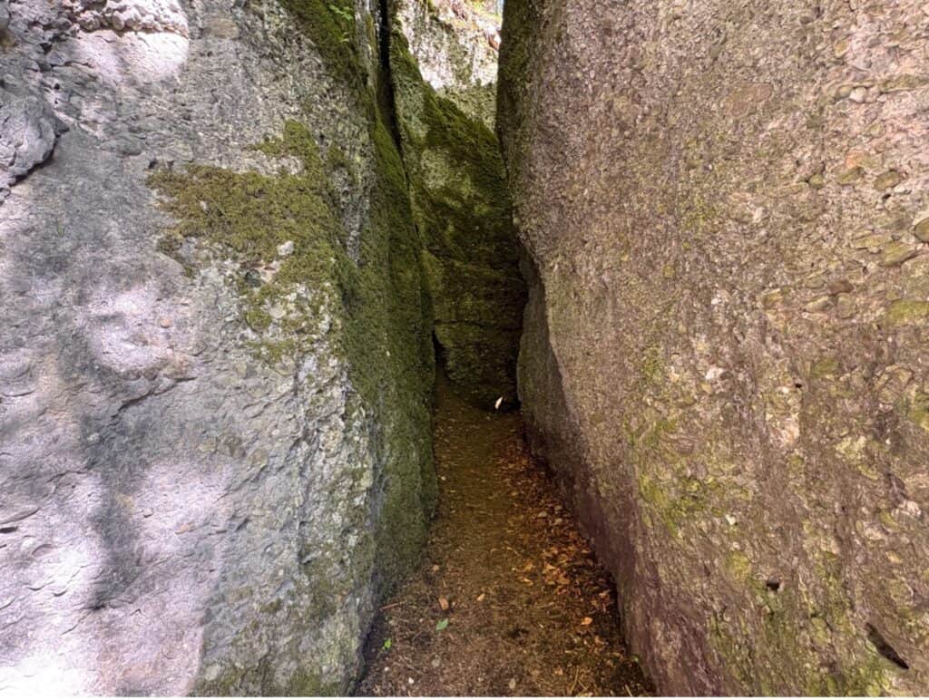 Narrow rocky opening leading towards the Äulischlucht gorge and waterfall