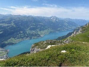 View of turquoise blue Lake Walen from Chäserrugg Rosenboden trail