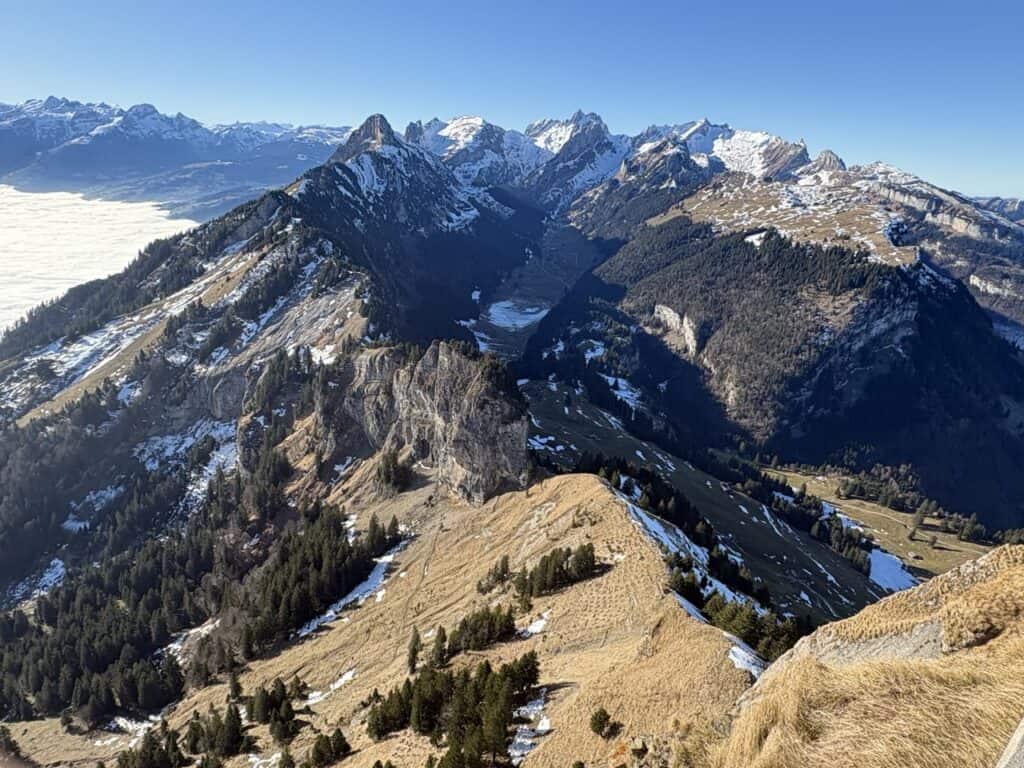 View from the Hoher Kasten summit overlooking the dramatic Alpstein mountain massif.