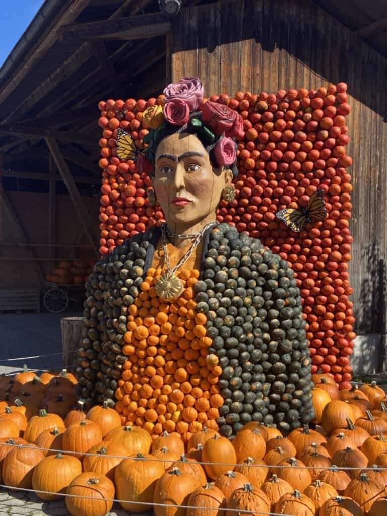 Pumpkin sculpture of Frida Kahlo exhibited at Jucker Farm in Seegräben during autumn.