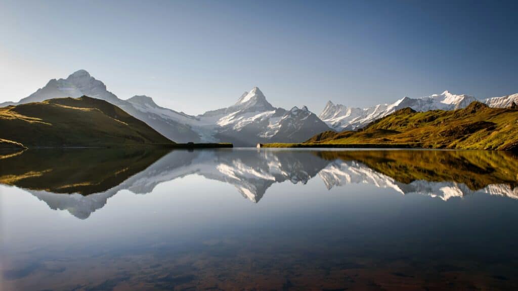 Bachalpsee near Grindelwald in the Bernese Oberland, a mountain lake reflecting alpine peaks and reachable by foot from the First summit.