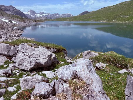 Glattalpsee in Central Switzerland, a crystal-clear mountain lake at 1850 meters above the Bisis valley in the canton of Schwyz.