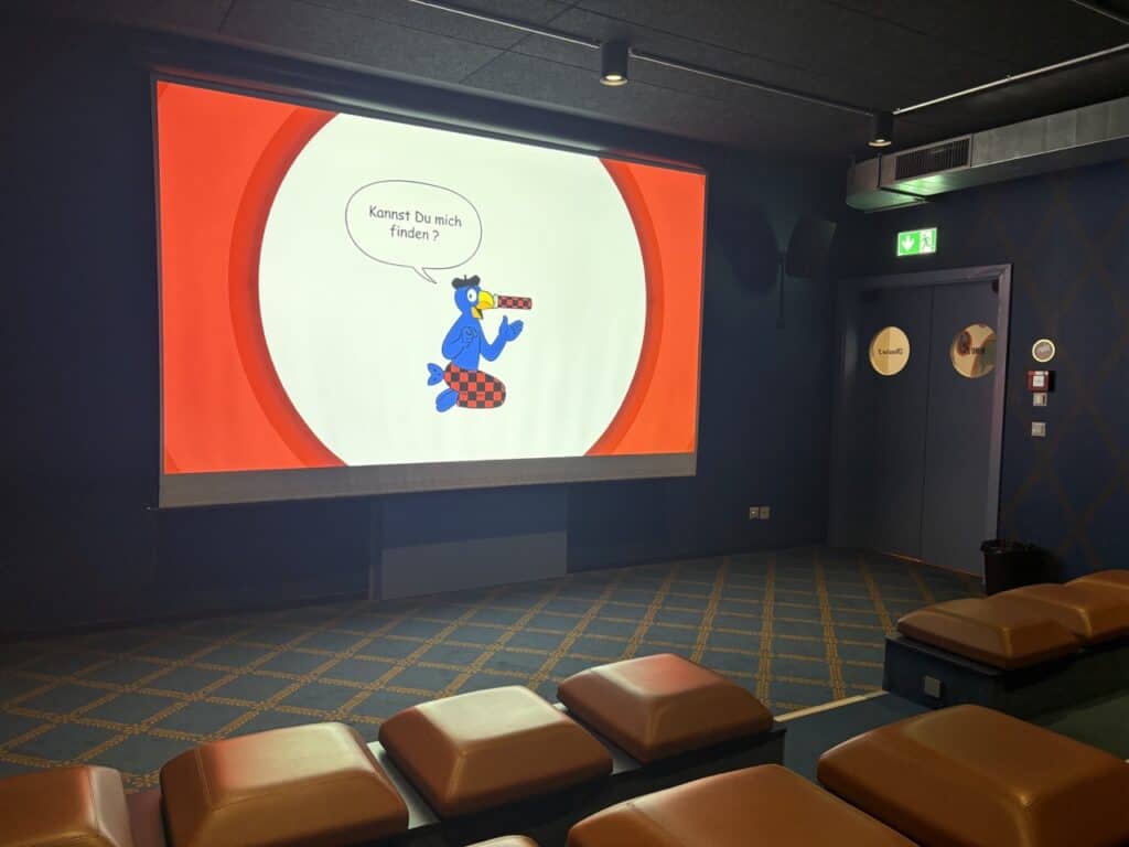 Small cinema in the Maestrani Chocolarium chocolate factory museum where you sit on small chocolate themed seats.