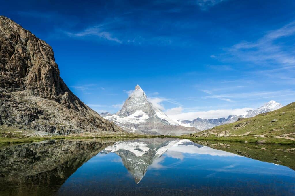 Riffelsee near Zermatt on a clear day, a famous Swiss Alpine lake reflecting the iconic Matterhorn peak.