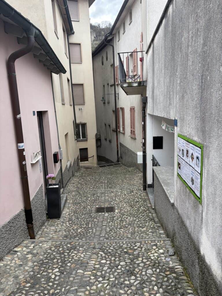 Uphill path leading through the Old Town to Castel Grande on the Bellinzona castles hike. 