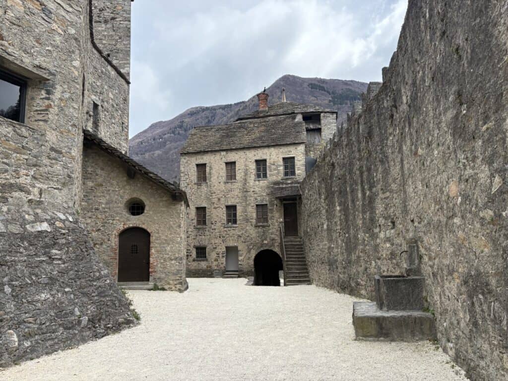Court yard and stone walls of Castello di Montebello perched above Bellinzona 