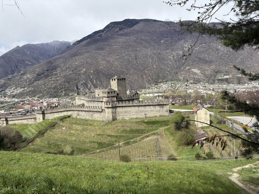 View of Montebello Castle perched on a hill and surrounded by greenery