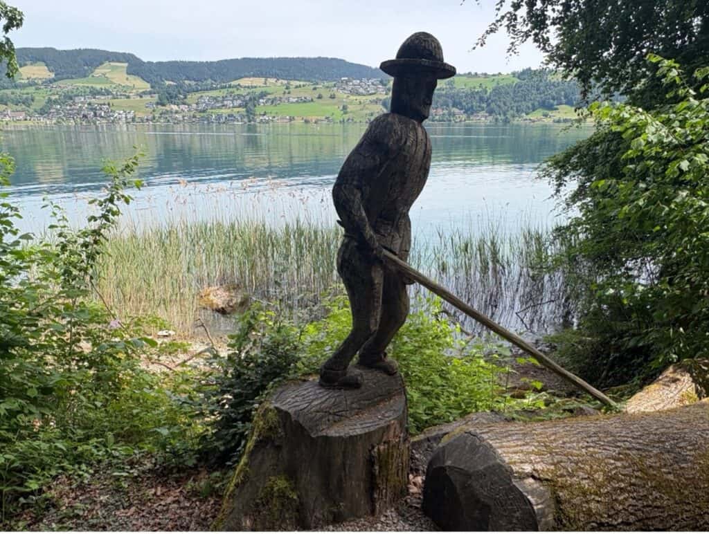 Wooden sculpture at Lake Ägeri commemorating the tradition of timber rafting (Flössen).