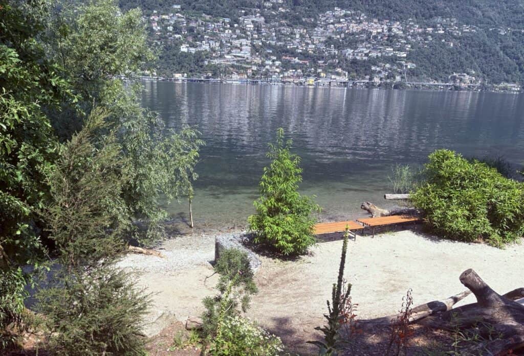 Public lakeside swimming area in Switzerland, where visitors can relax, swim and enjoy the lake free of charge.