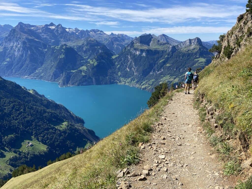 Scenic hiking trail through the Swiss Alps, where visitors can enjoy spectacular mountain landscapes for free.