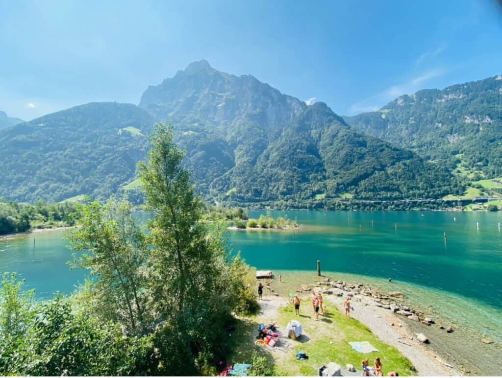 The Lorelei bathing islands in the Urnersee, showing clear turquoise water and a shallow shoreline resembling the Caribbean.