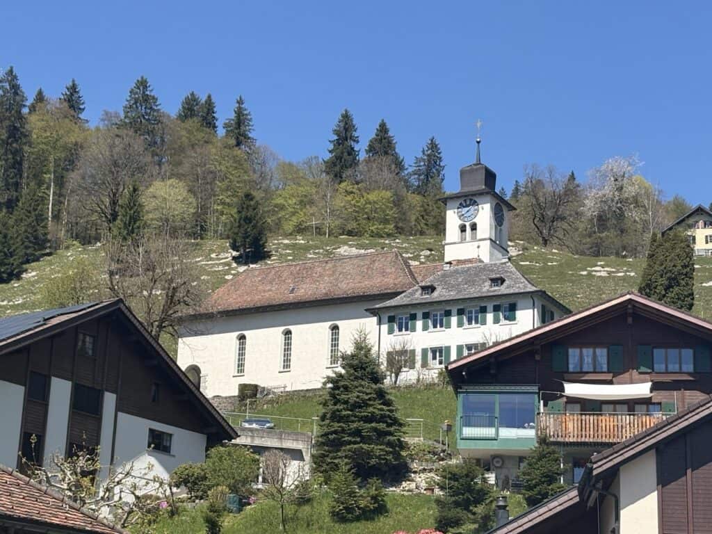 Village of Innerthal with its church above Wägitalersee lake