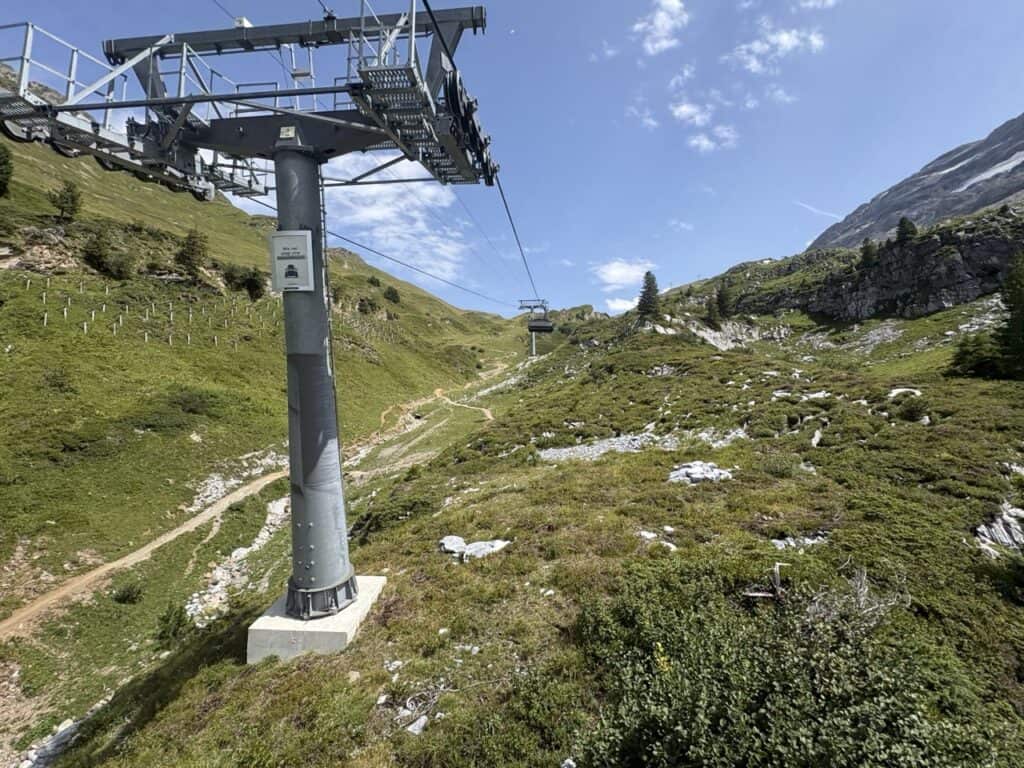 Chairlift ascending from Engstlenalp to Jochpass, surrounded by spectacular mountain scenery in the Swiss Alps.