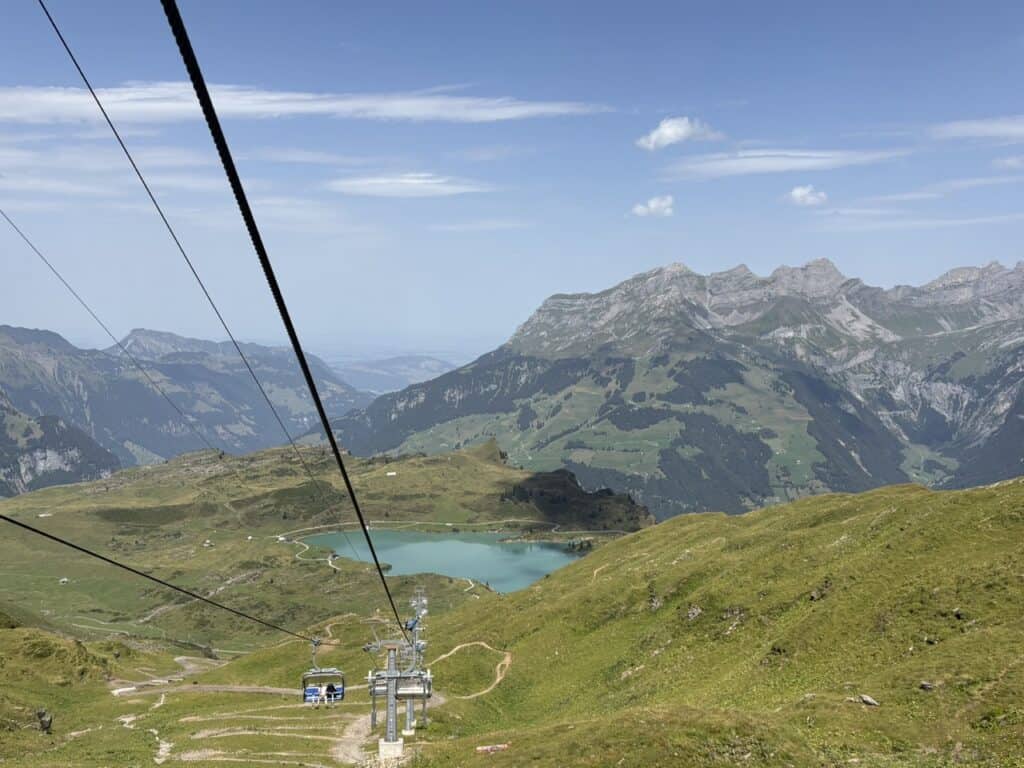 Chairlift descending from Jochpass towards Trübsee, offering beautiful views of the lake.