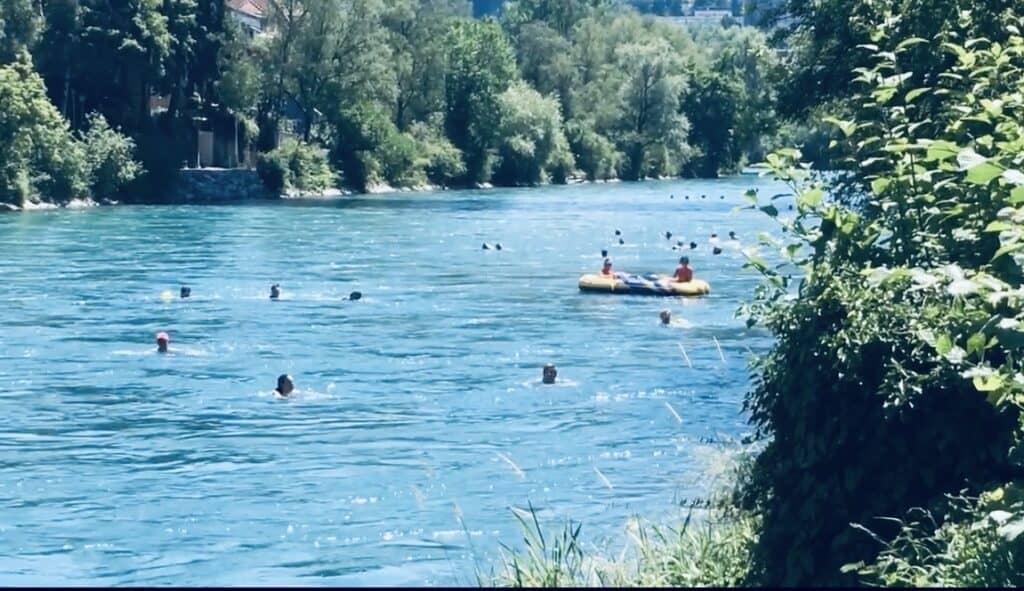The Aare River at Marzili in Bern on a hot summer day, a popular spot for swimming, relaxing by the water and enjoying a free summer activity in Switzerland.